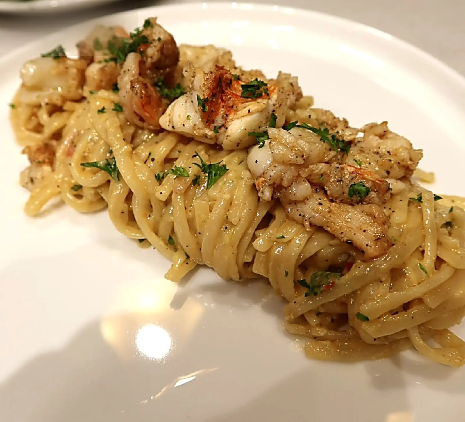 Crab linguine plated for a private dinner